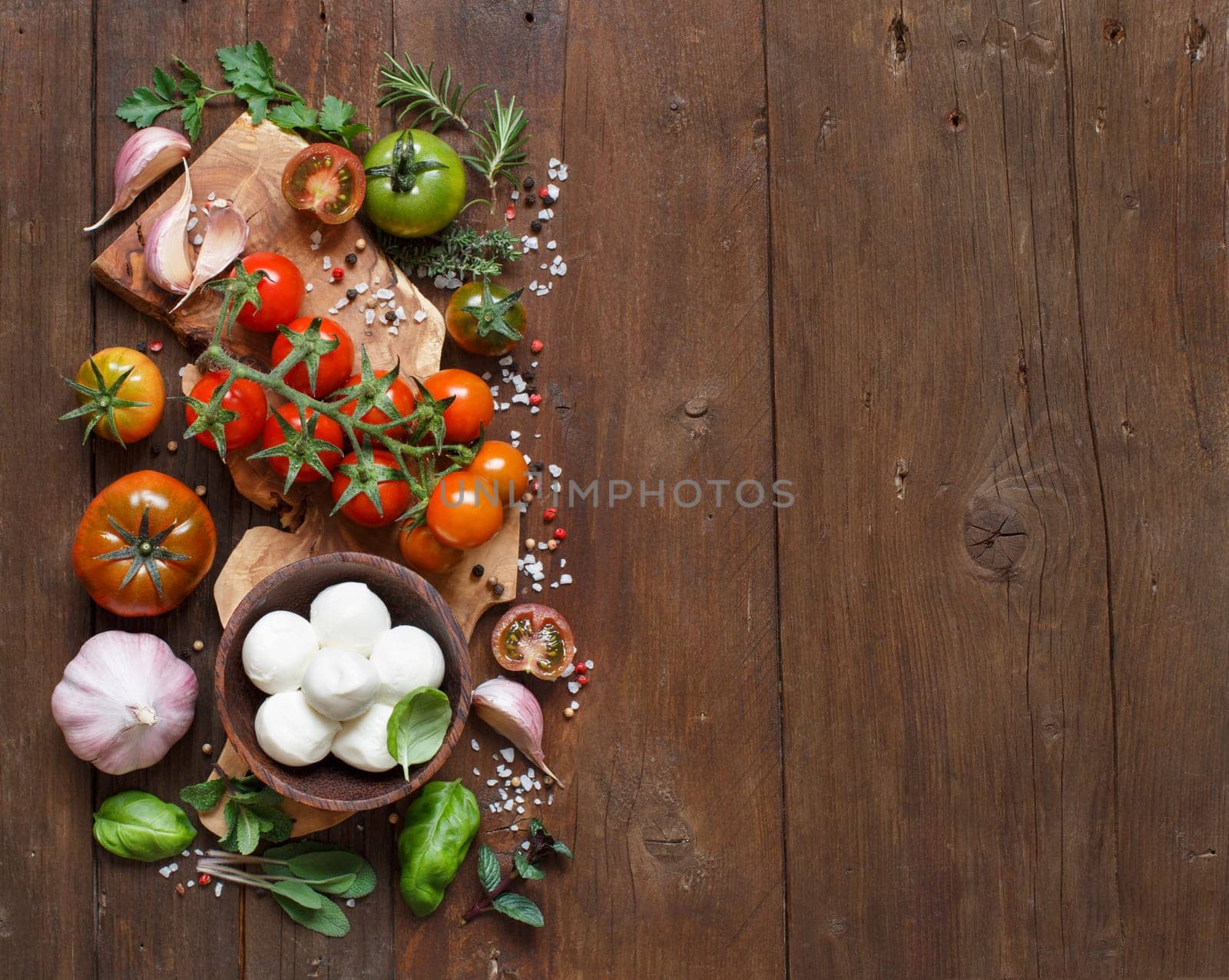 Italian cooking ingredients : mozzarella, tomatoes, garlic, herbs and other