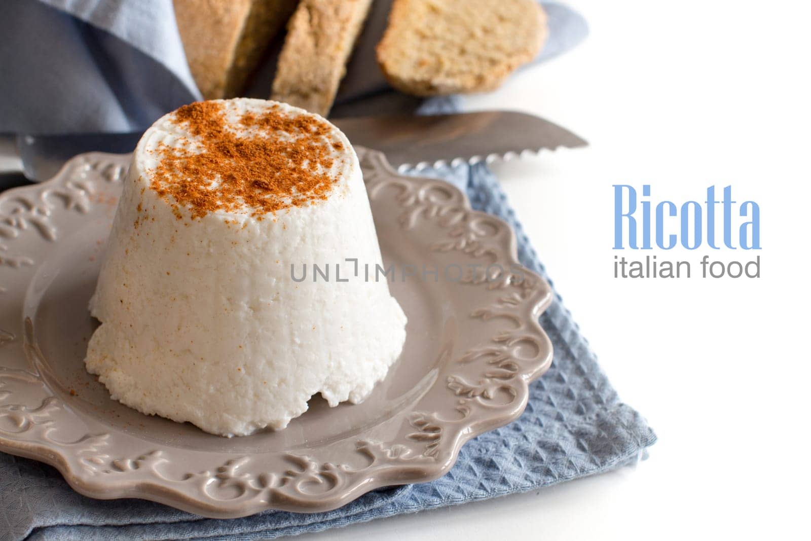 Italian ricotta cheese and homemade bread isolated on white