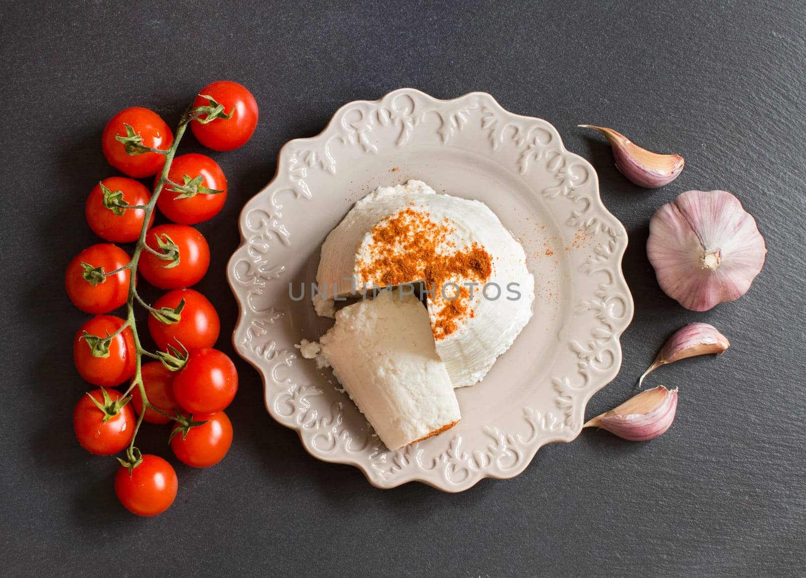 Italian ricotta cheese, garlic and cherry tomatoes top view
