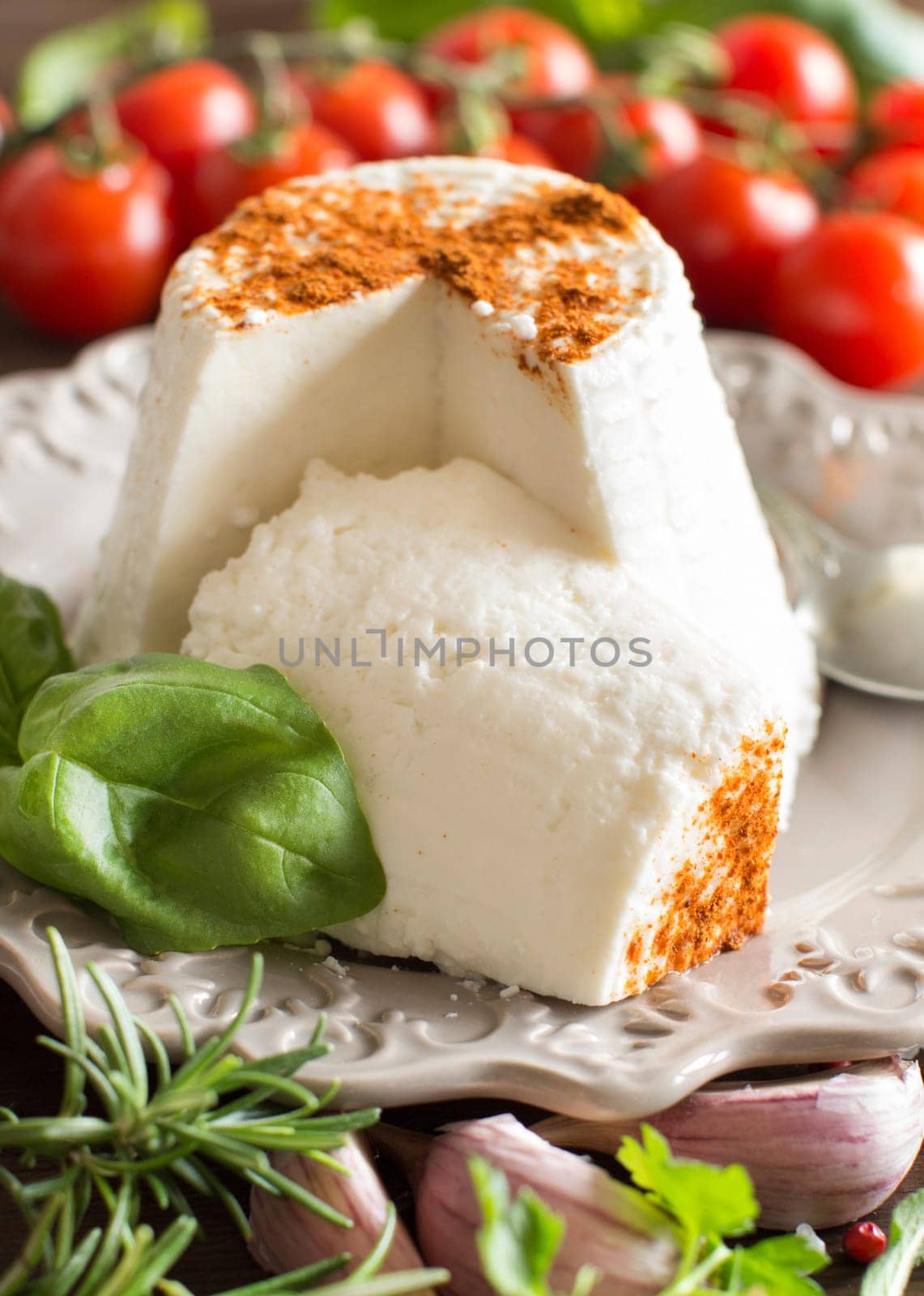Italian ricotta cheese, vegetables and herbs close up