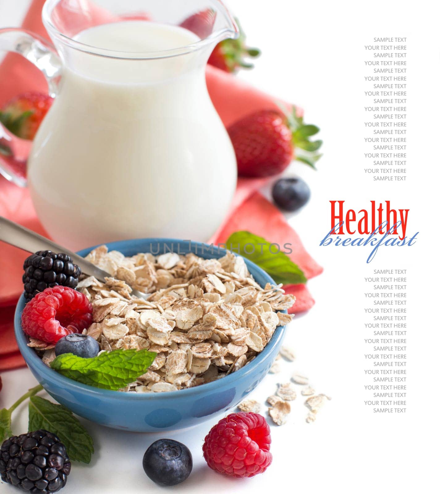 Rolled oats in a bowl with berries and milk isolated on white