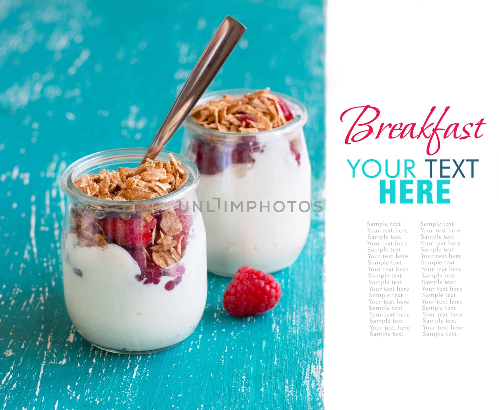 Raspberries, flakes and fresh yogurt in a jar