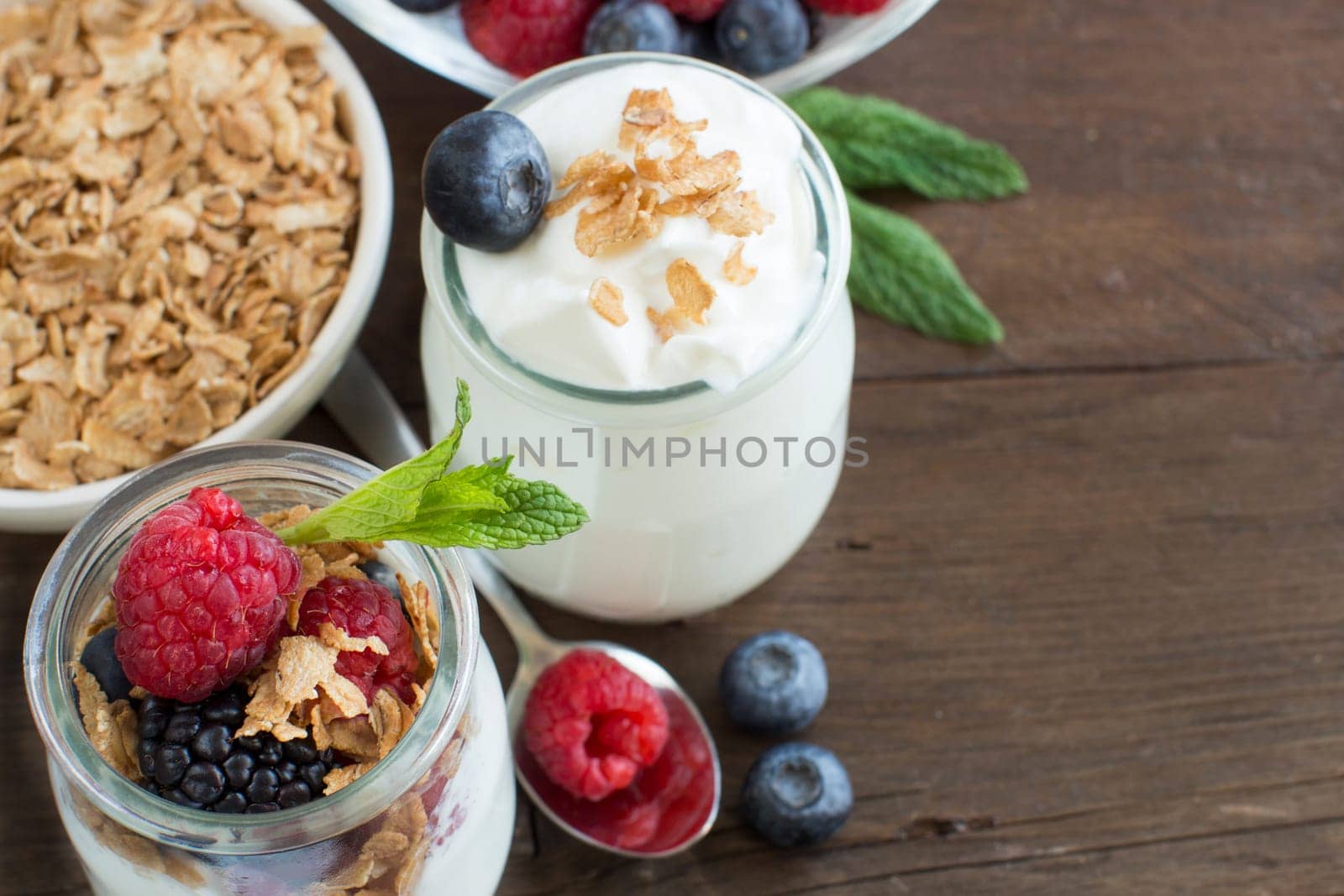 Healthy breakfast with Fresh greek yogurt, flakes and berries