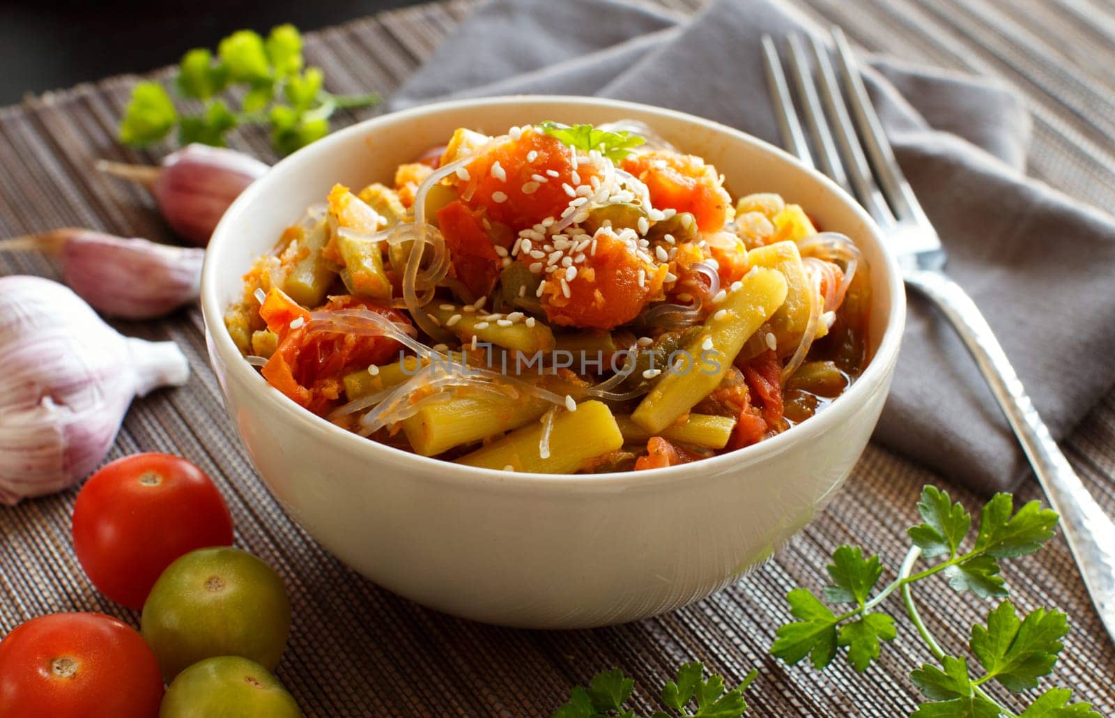 Rice spaghetti with vegetables in a bowl close up