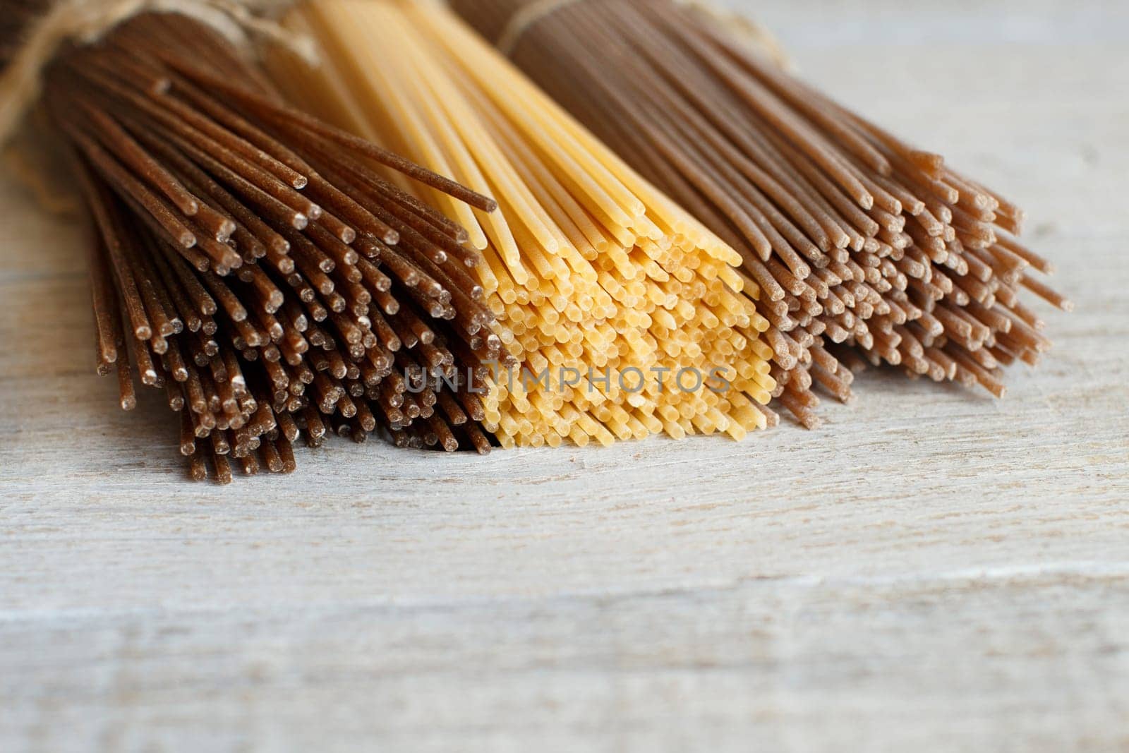 Italian spaghetti on the old wooden table close up