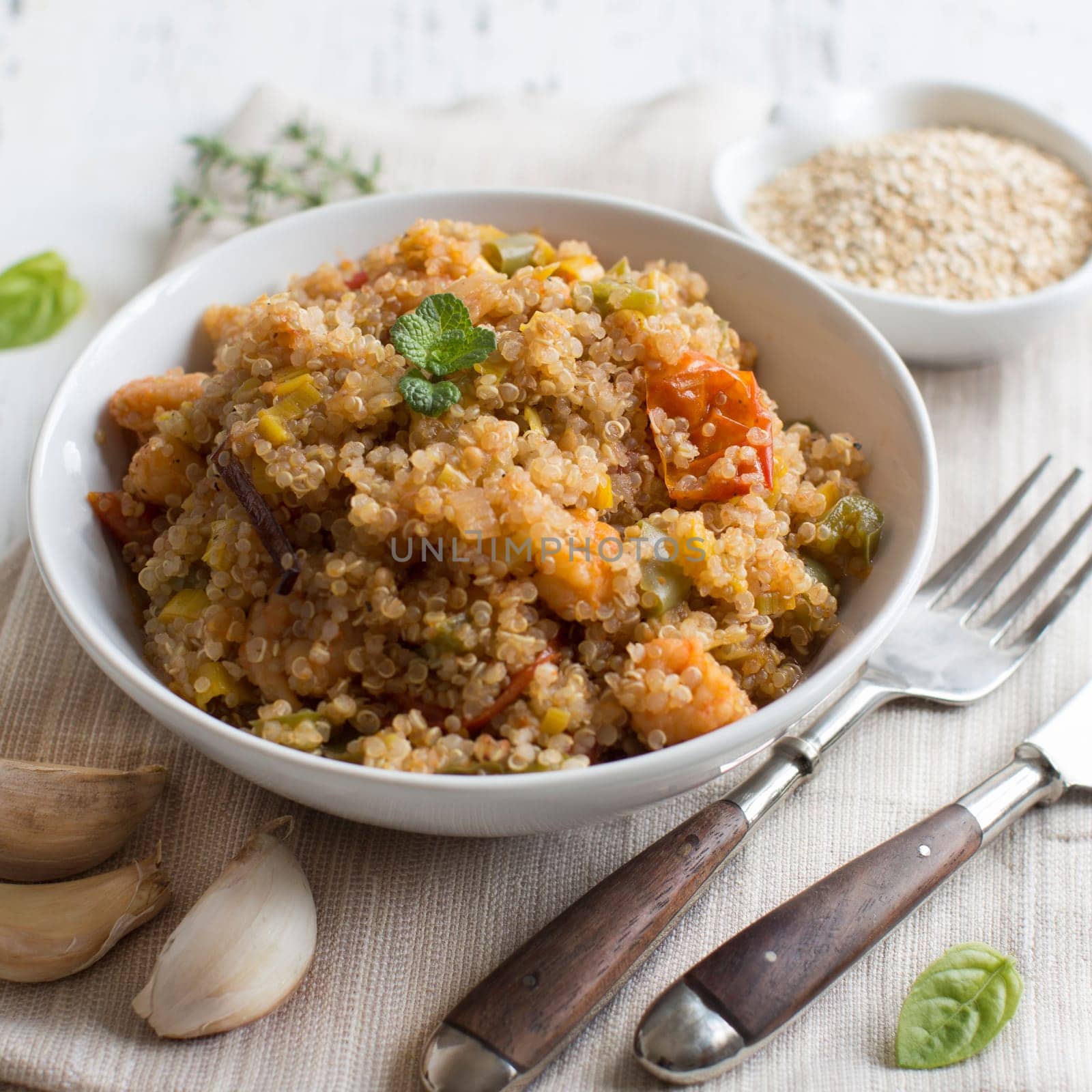 Cooked Quinoa with vegetables and shrimps in a bowl