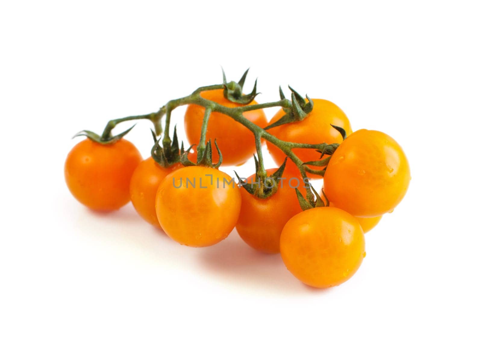 Fresh yellow cherry tomatoes isolated on white background