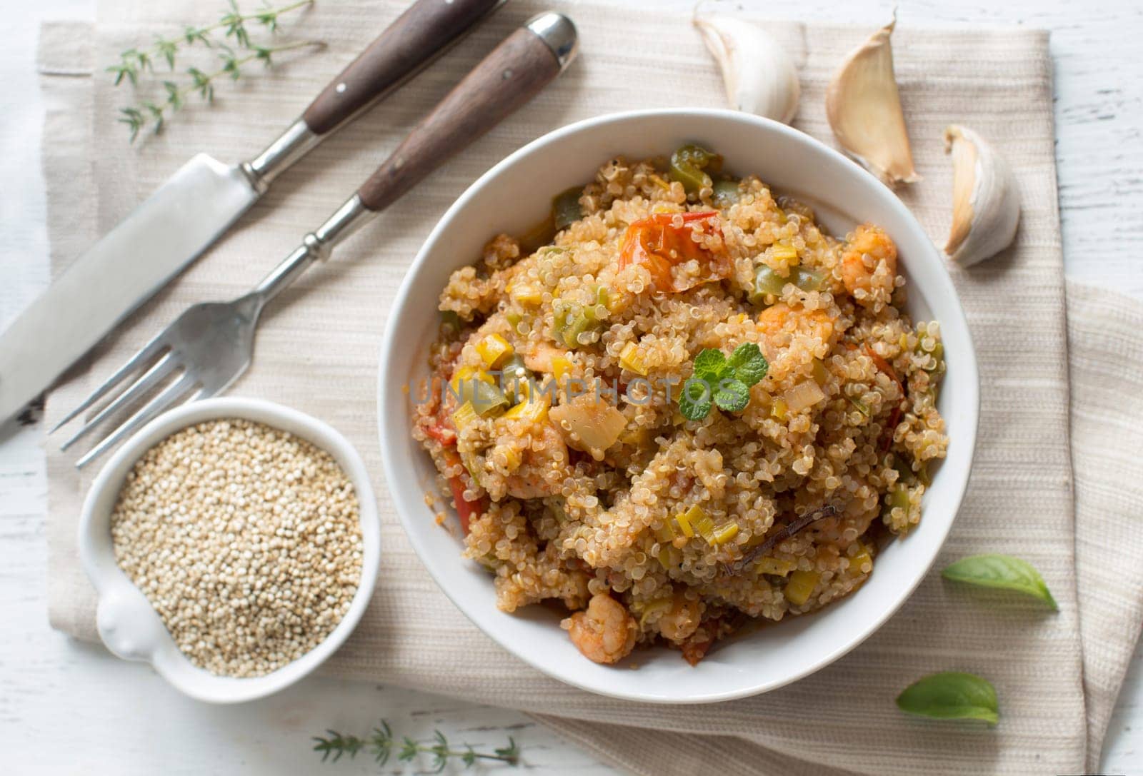 Cooked Quinoa with vegetables and shrimps in a bowl