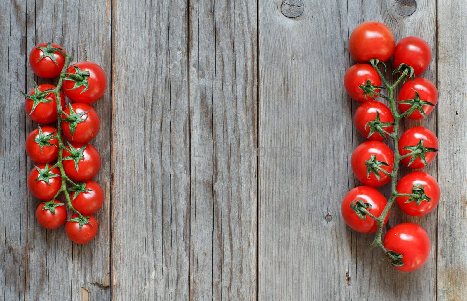Cherry tomatoes on a wooden table background