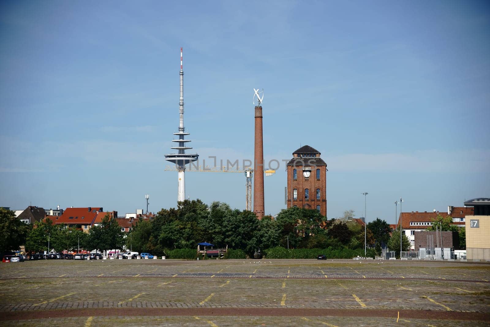 The Bürgerweide car park in Bremen at the ÖVB Arena with the Messeturm in the background.