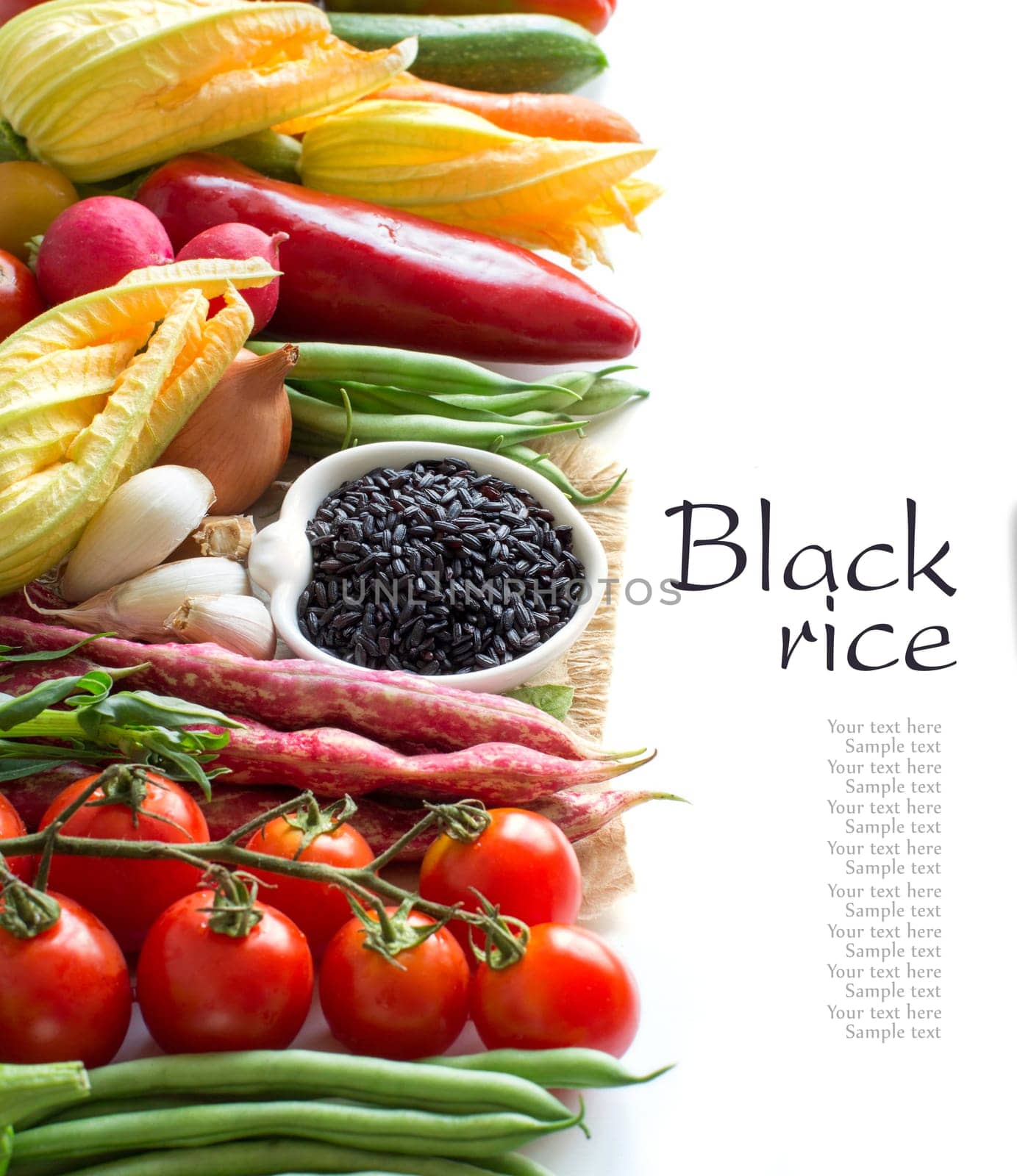 Raw black rice in a bowl and fresh vegetables isolated on white