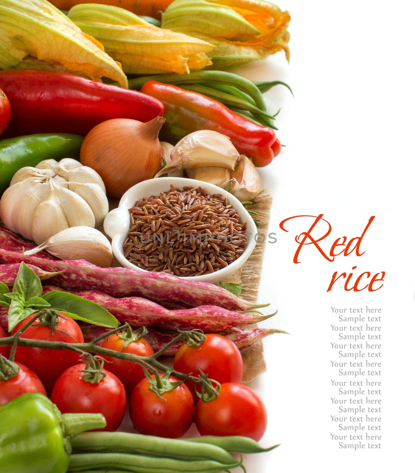 Raw red rice in a bowl and fresh vegetables isolated on white