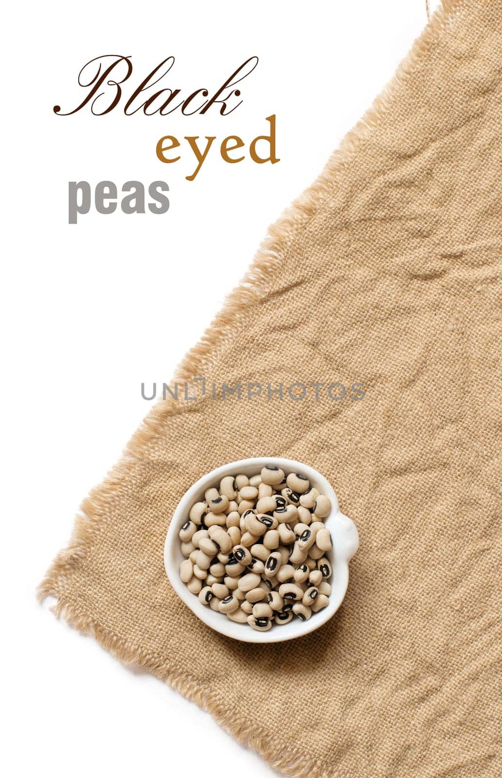 Black eyed peas in a bowl on burlap top view