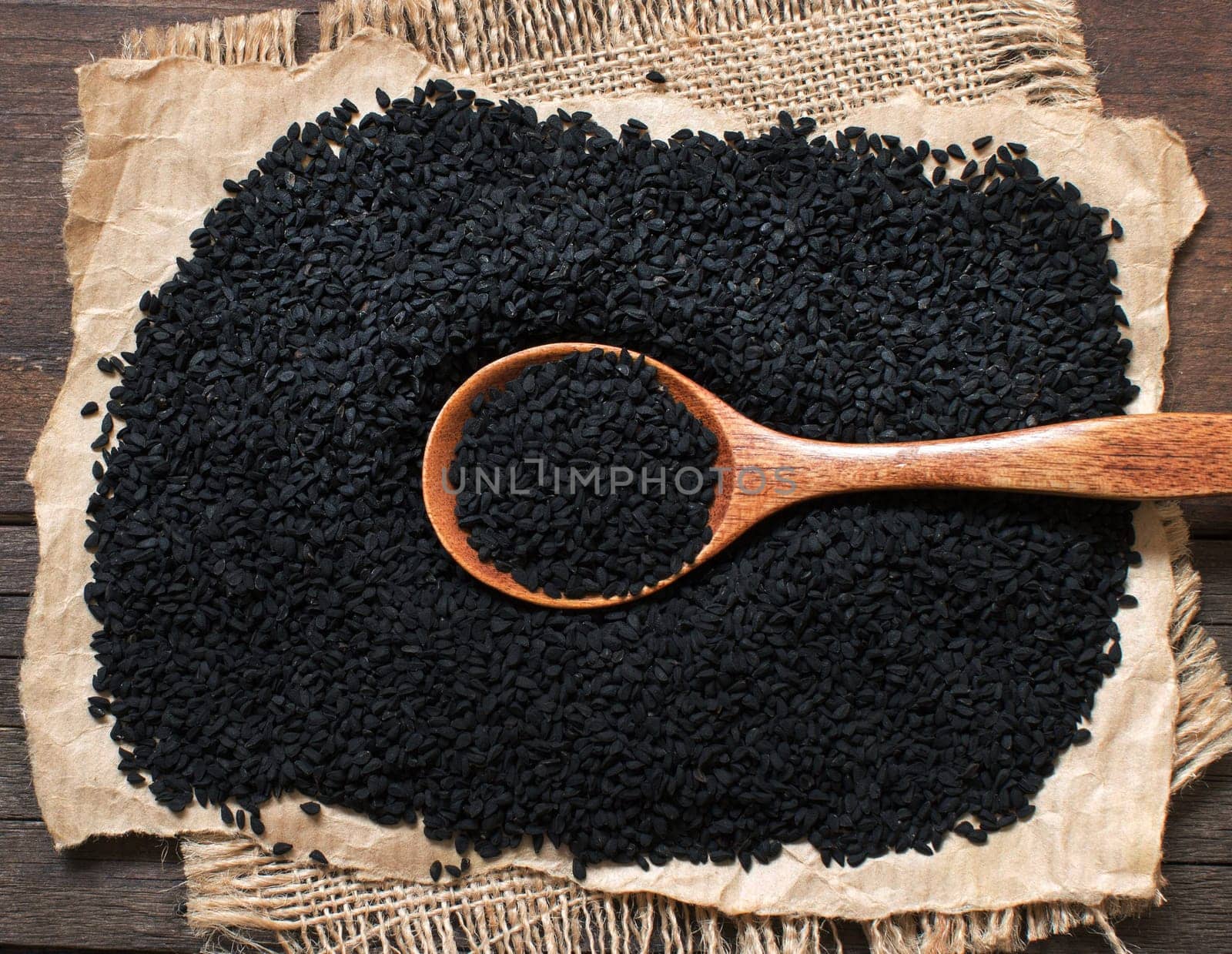 Nigella sativa or Black cumin with a spoon top view