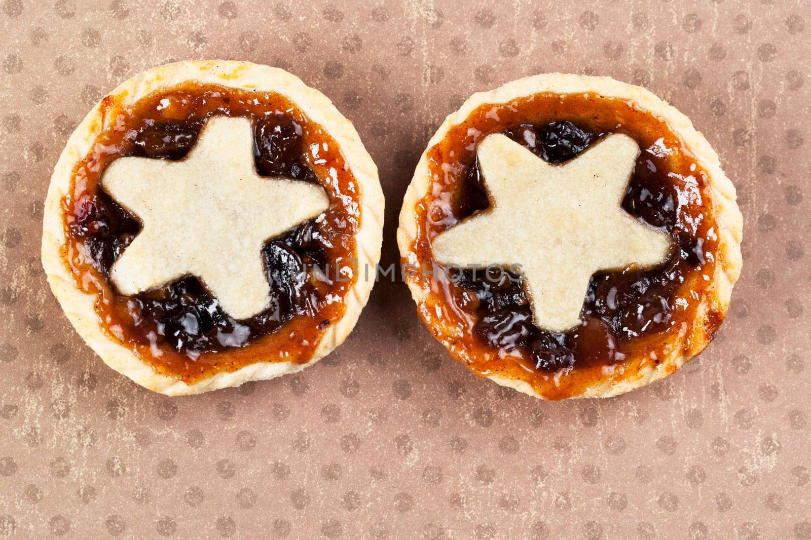 Holiday mince pies with star shape, viewed from above.