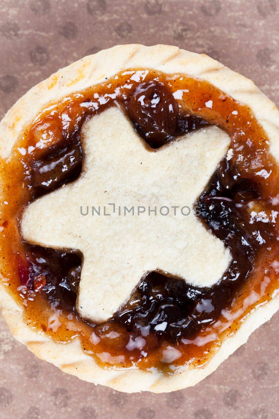 Holiday mince pies with star shape, viewed from above.