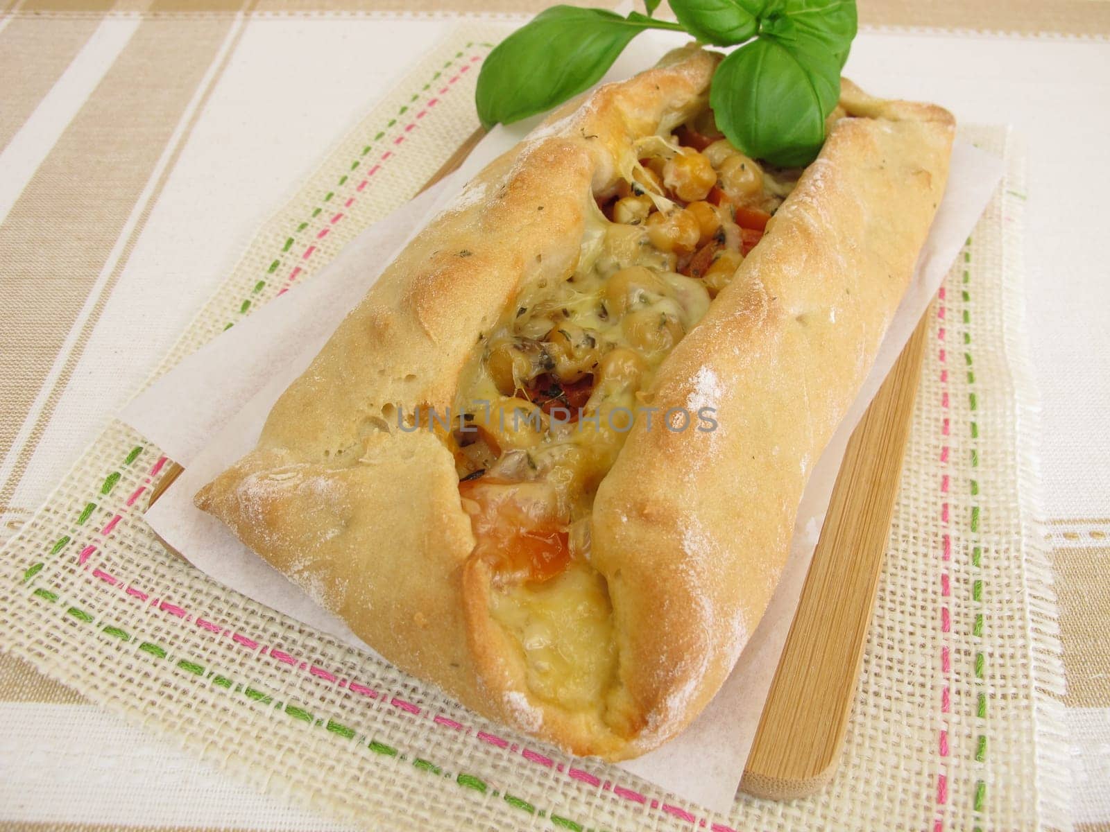 Stuffed pide bread with tomatoes,chickpeas and cheese