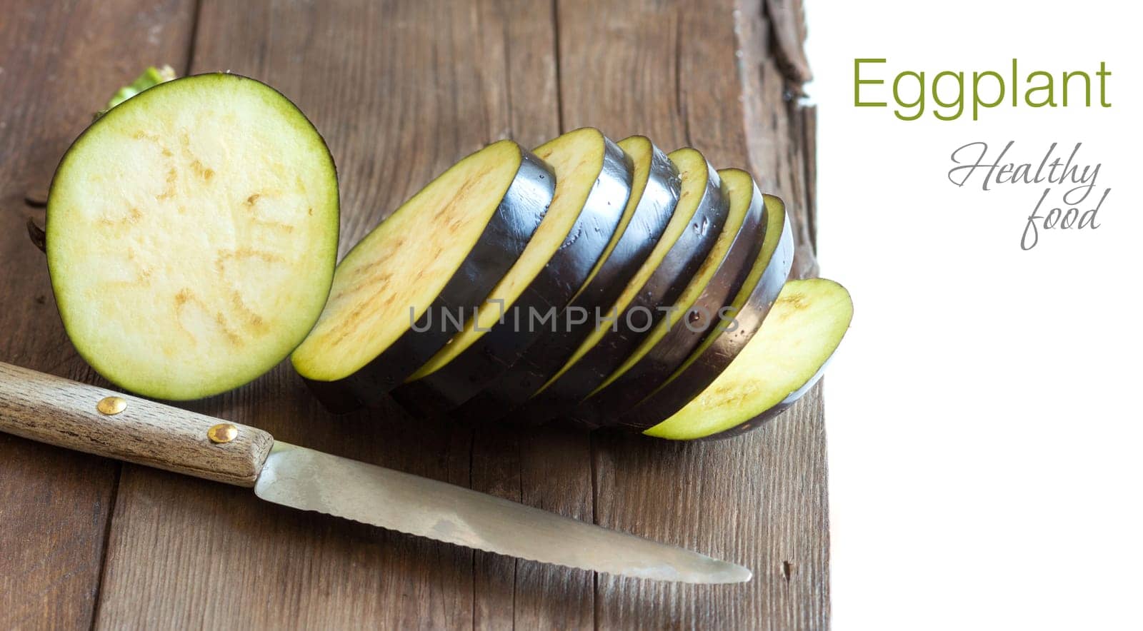 Fresh Raw eggplants with knife on the wood background
