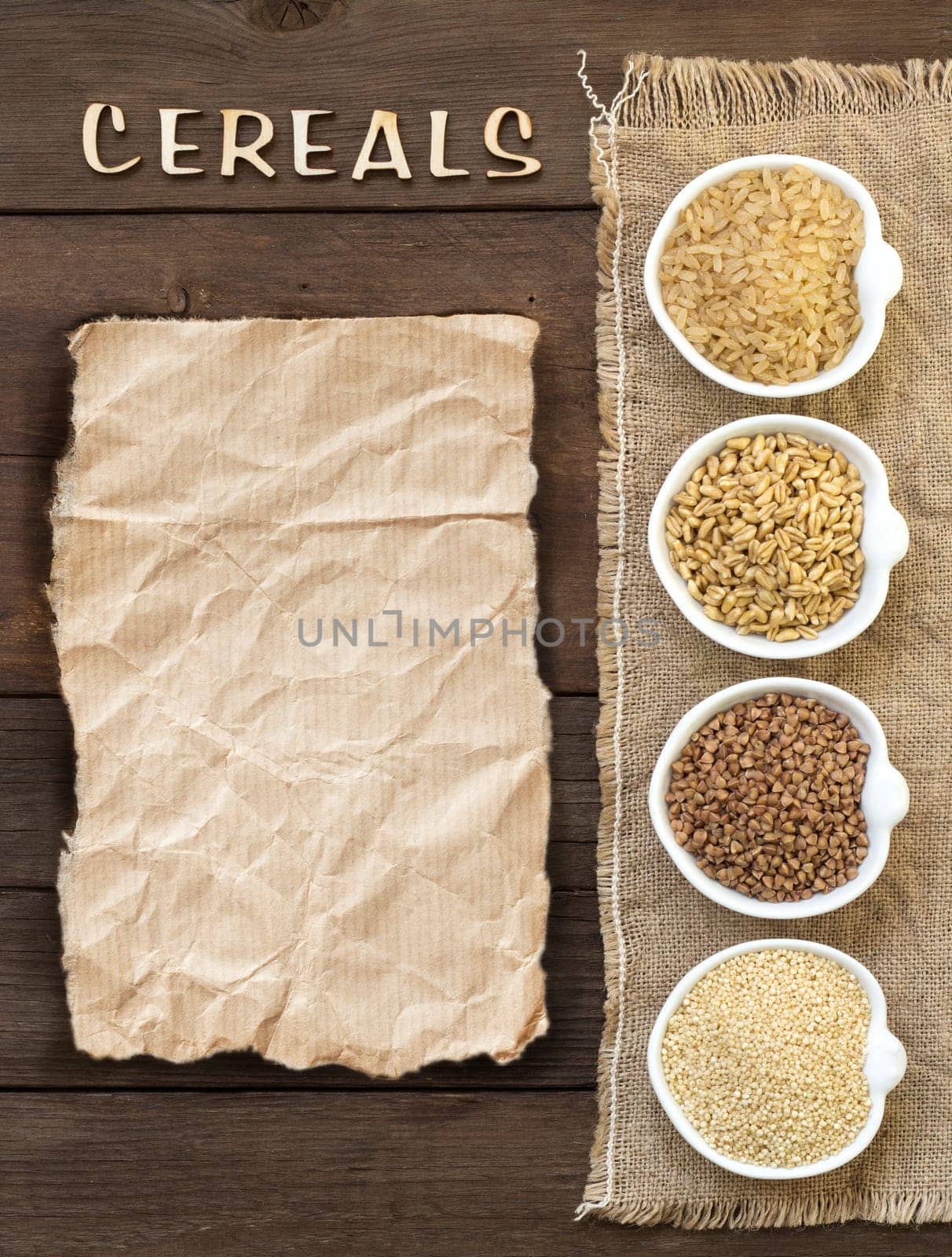 Cereals in bowls with word Cereals on wooden background