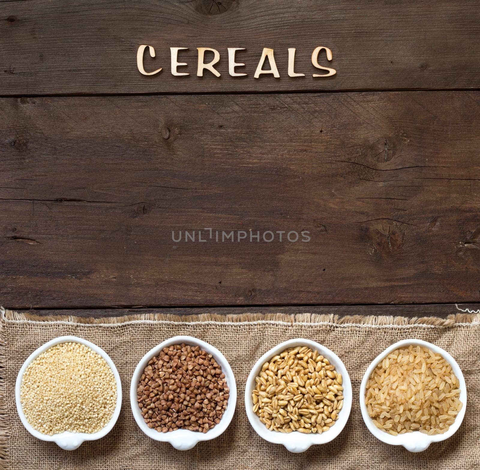 Cereals in bowls border with word Cereals on wood
