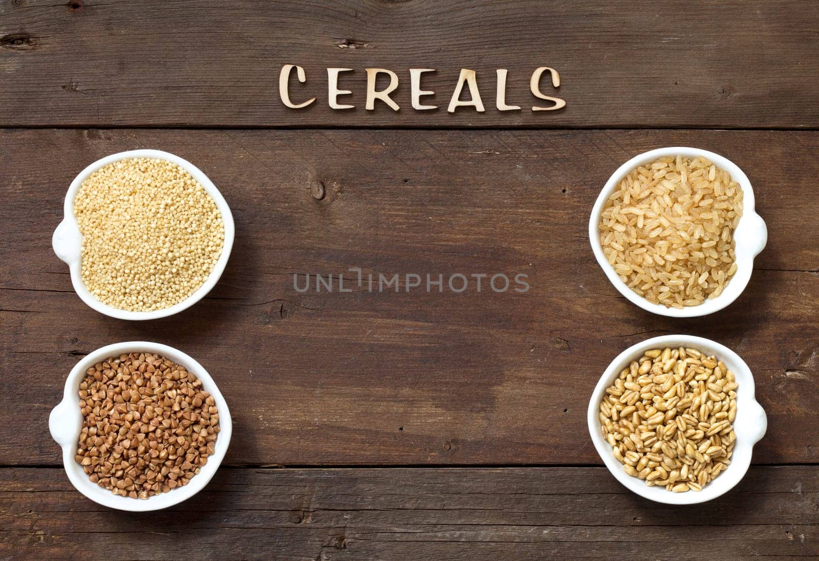Cereals in bowls border with word Cereals on wood