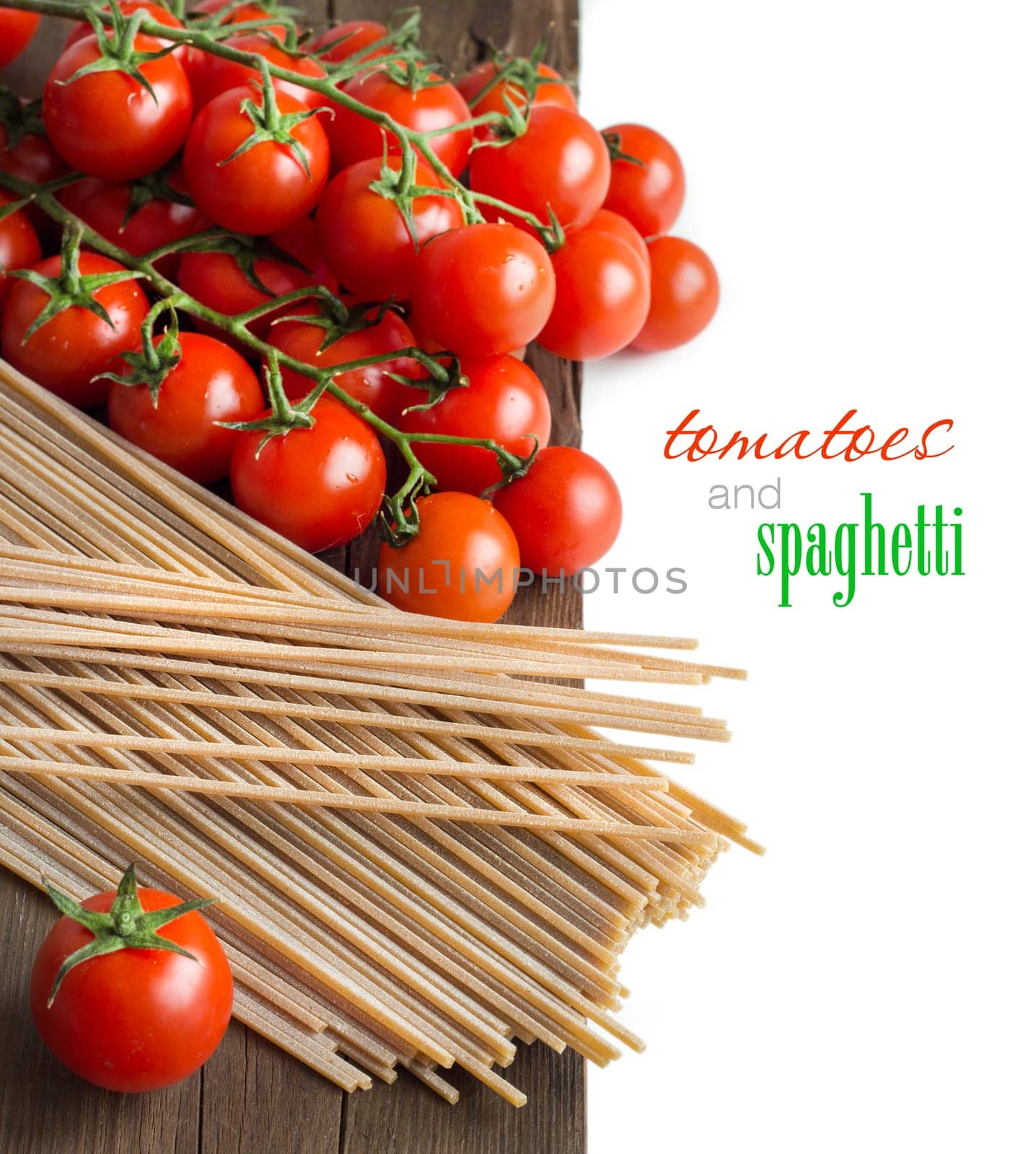 Spaghetti and tomatoes on old vintage wooden table