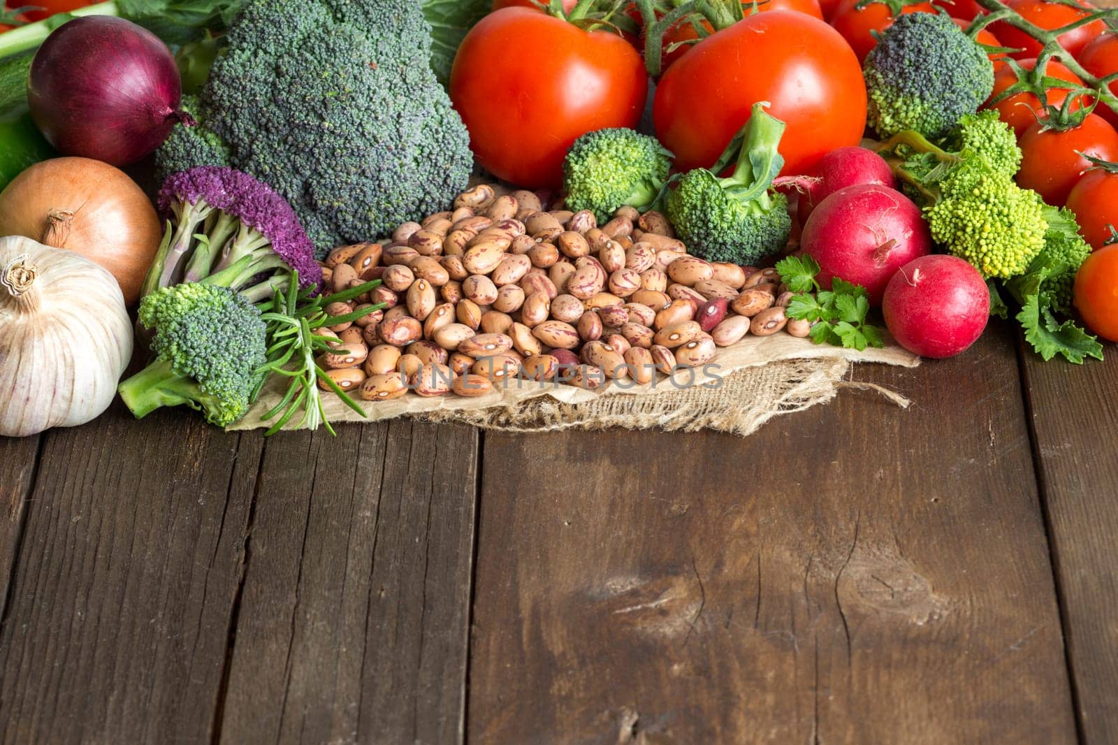 Pinto beans and vegatables on the old wooden table