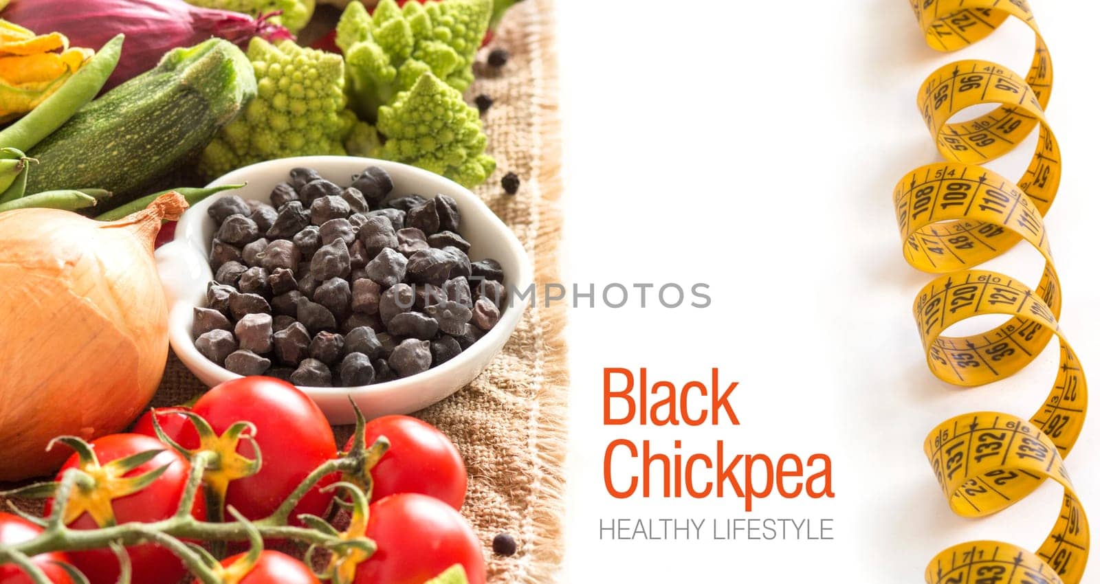Black chickpea in a bowl with vegetables isolated on white