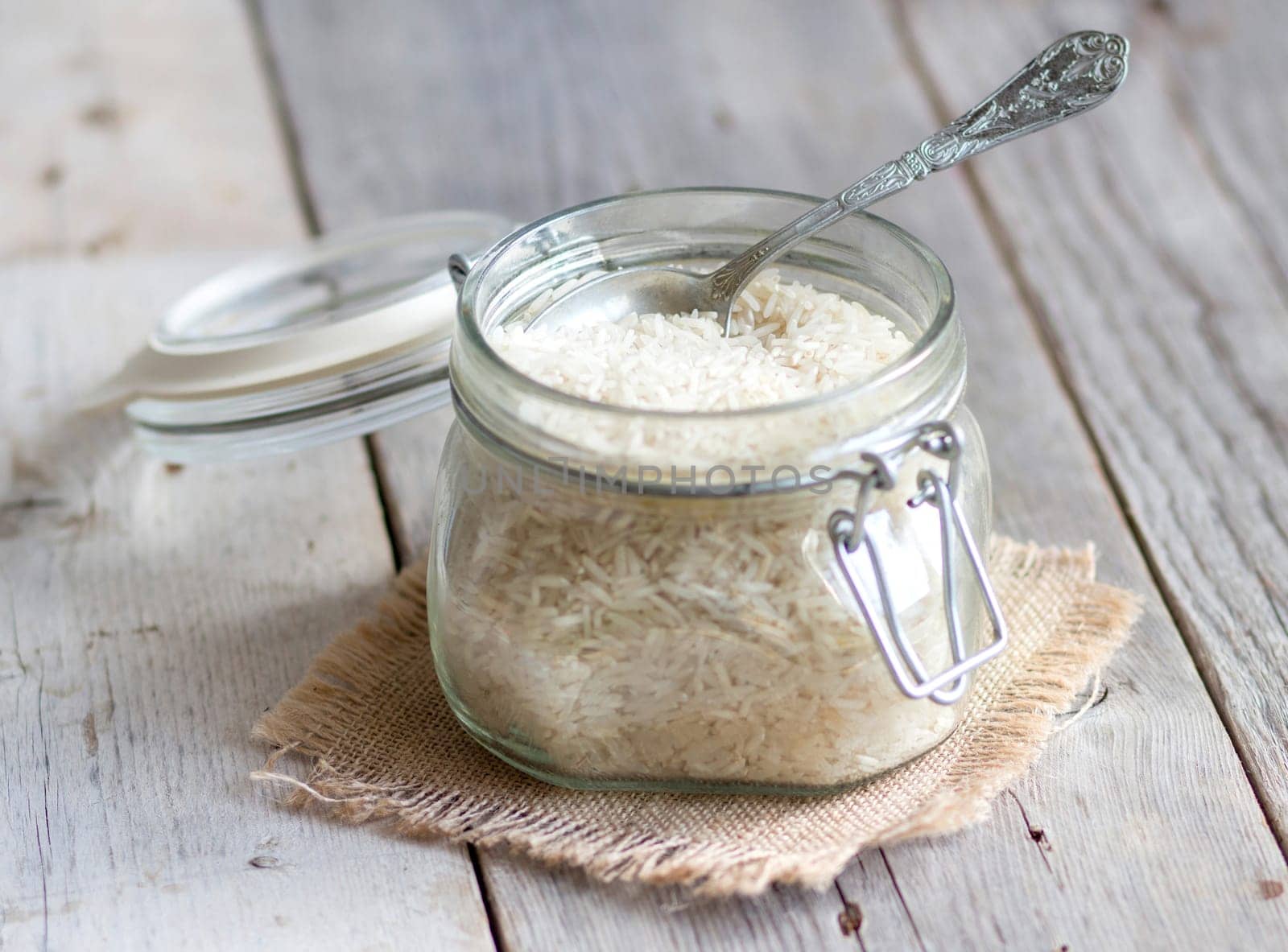 Basmati rice in a glass jar with a spoon