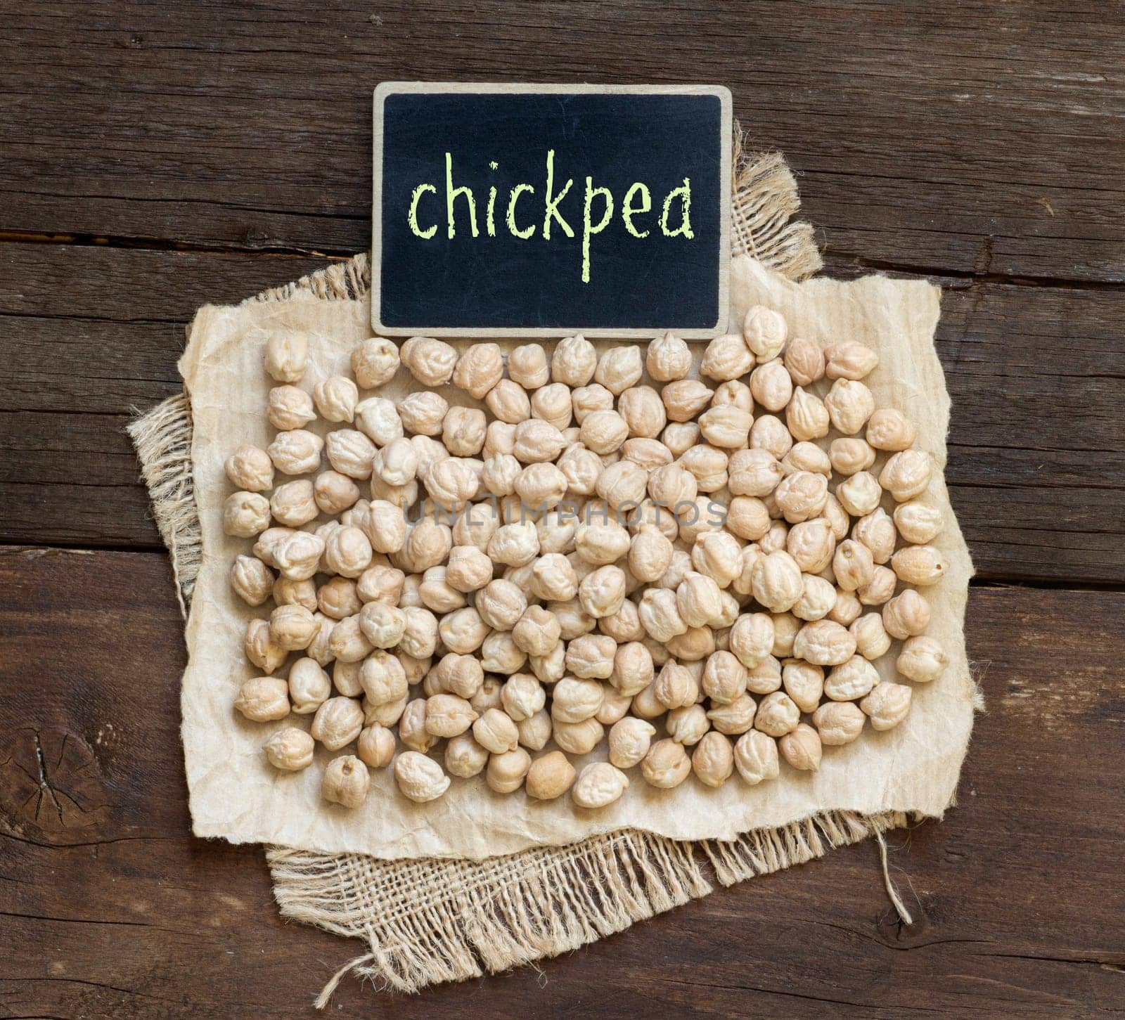 Chickpea with a small chalkboard on a wooden table