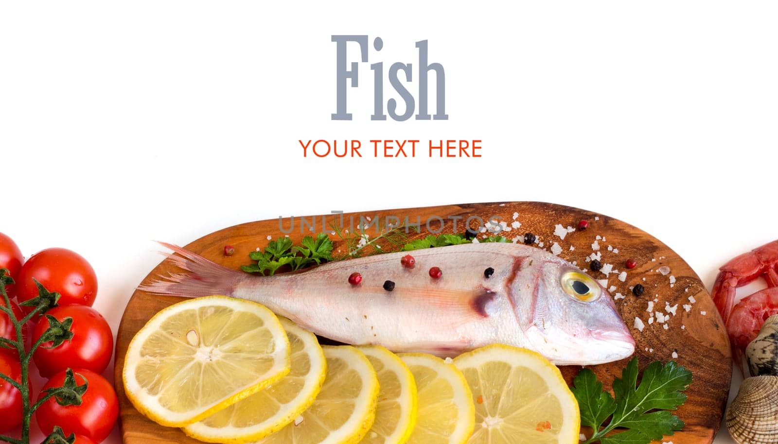 Fresh fish with seafood and vegetables on a wooden board isolated on white