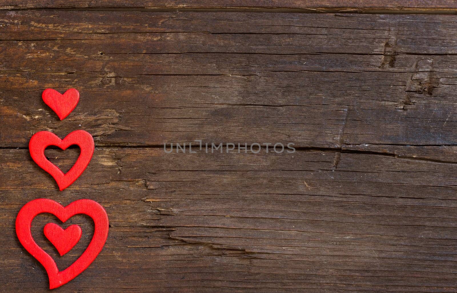 Rustic hearts on a old wooden background