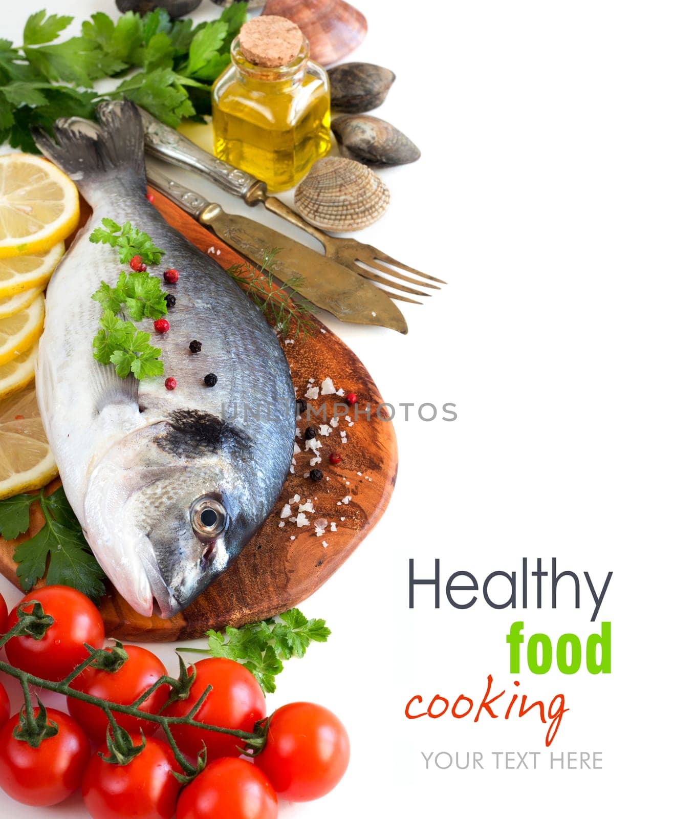 Fresh dorado fish, seafood and vegetables on a white background