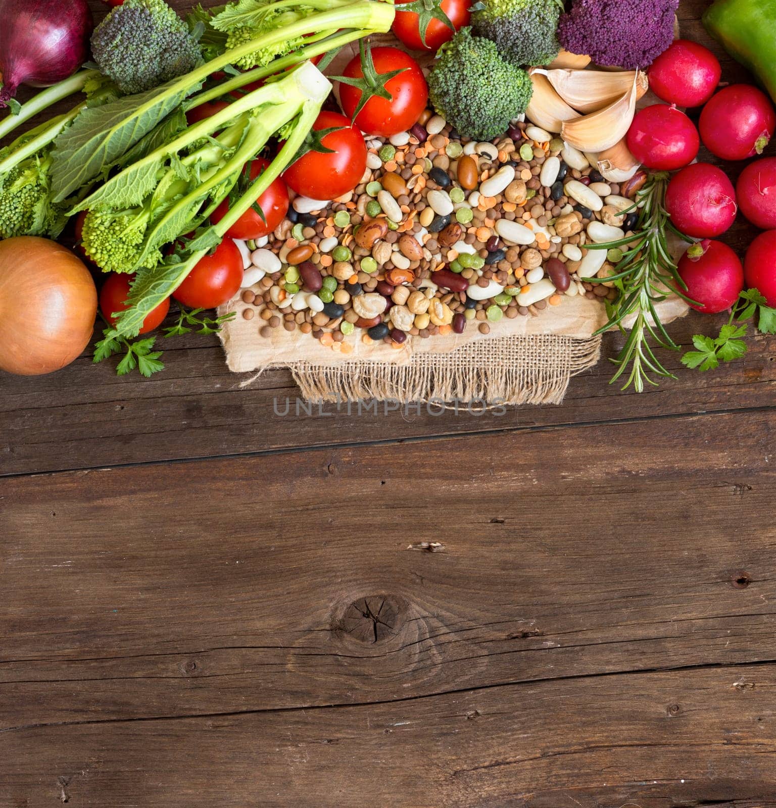 Mixed legumes and vegetables on a wooden table