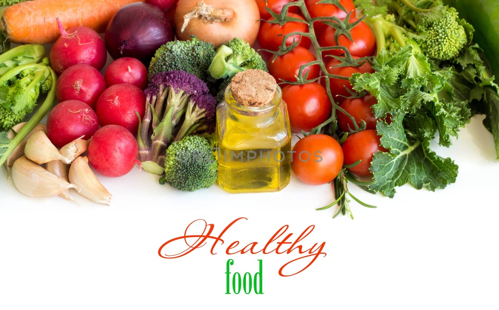 Vegetables and a bottle of olive oil isolated on white