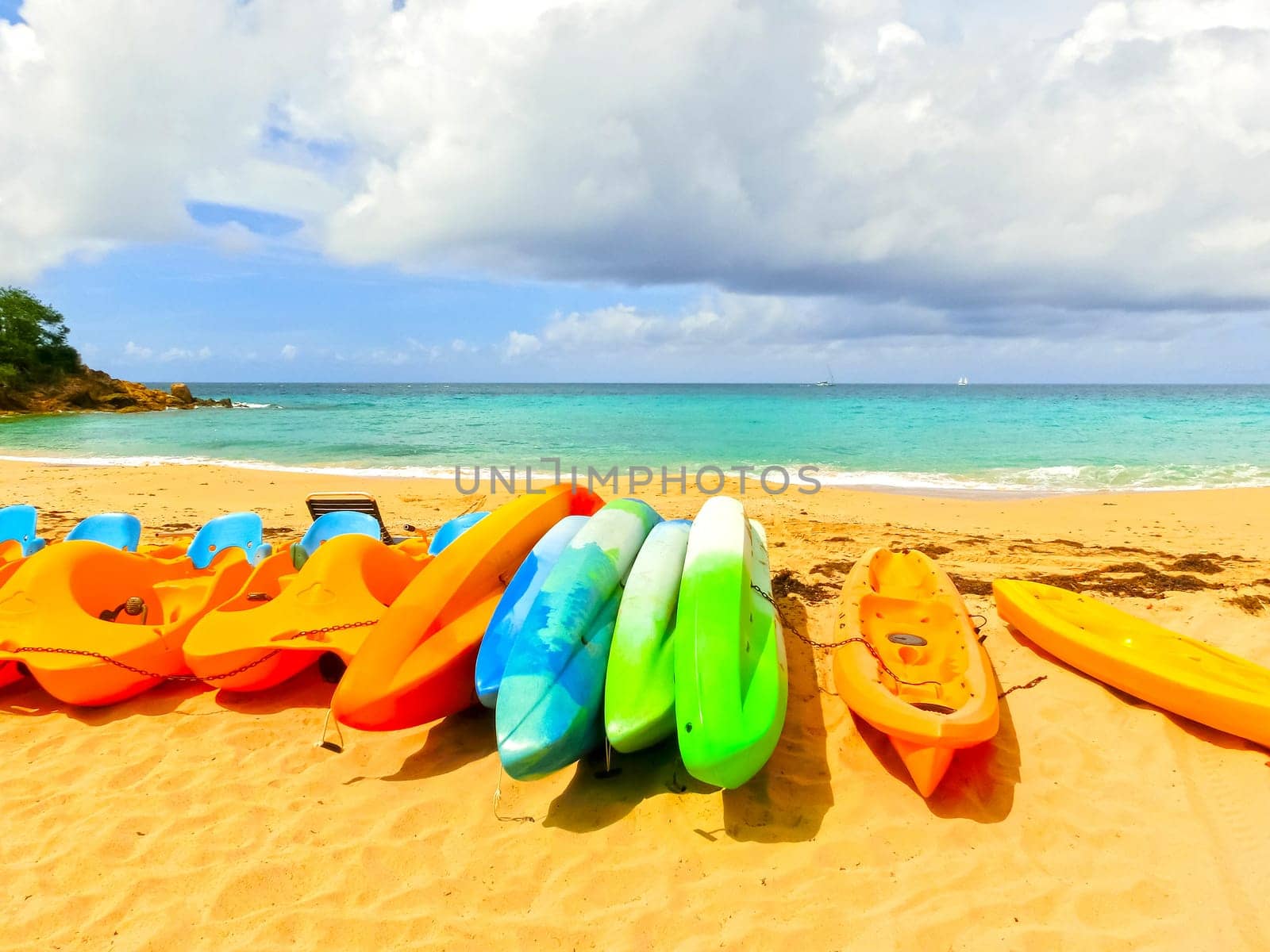 The colorful kayaks on the tropical beach