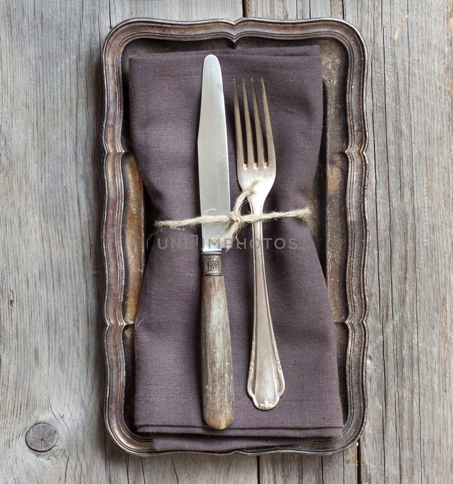 Vintage Table setting on napkin and metal tray