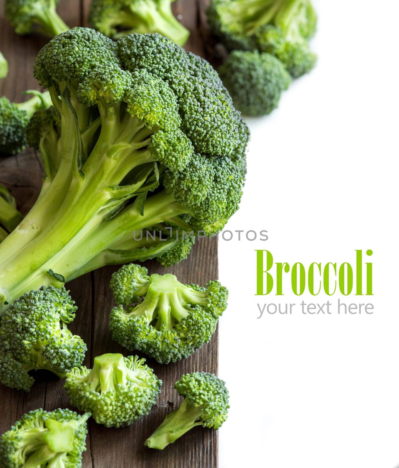 Fresh broccoli on old wooden table close up