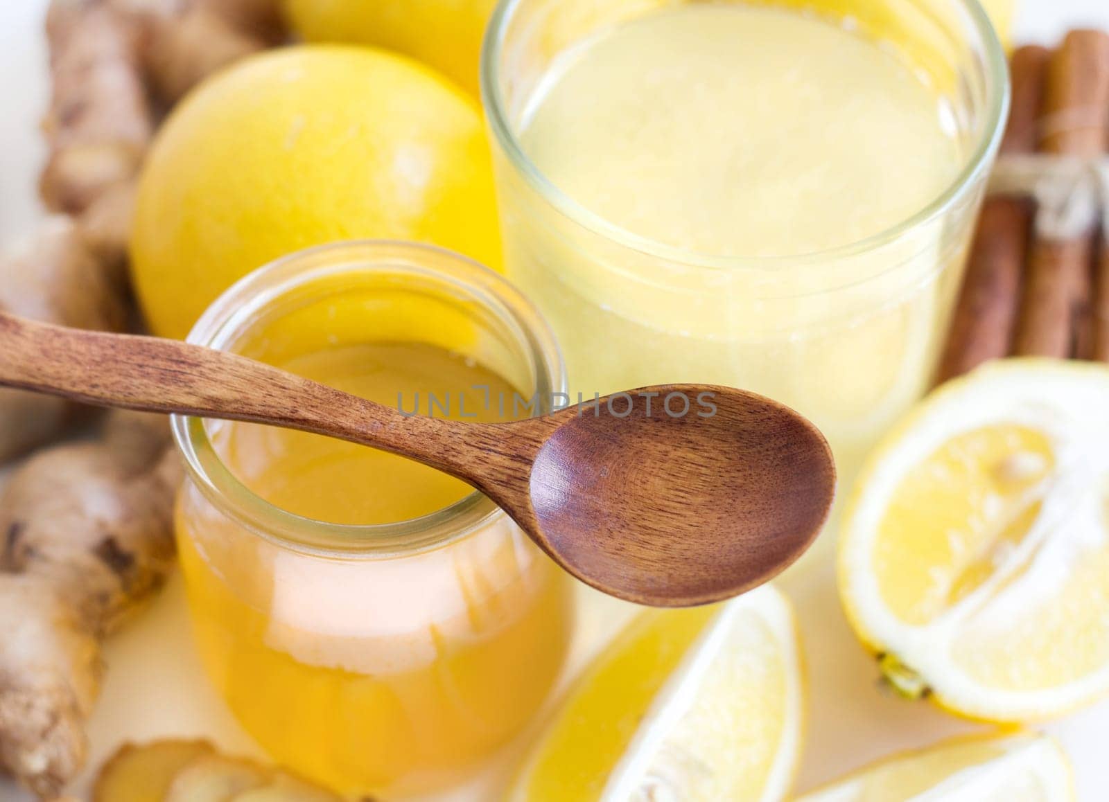Honey, lemon, ginger tonic and ingridients close up