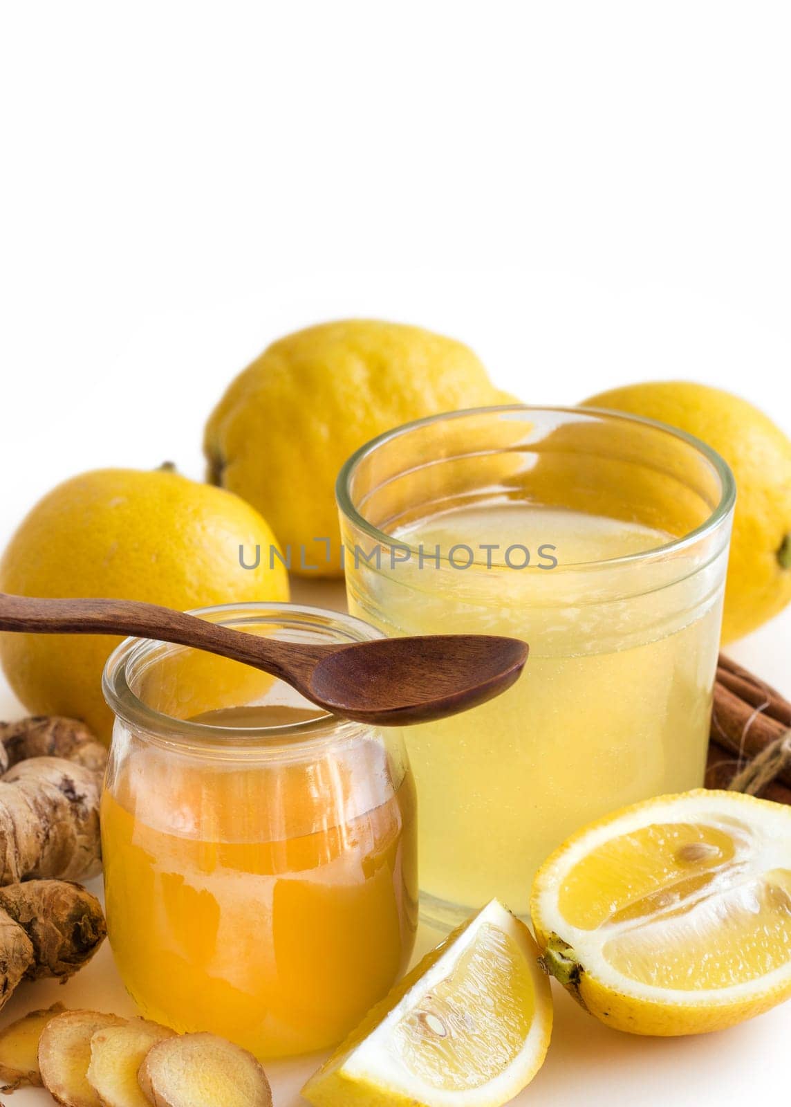 Honey, lemon and ginger tonic and ingridients close up