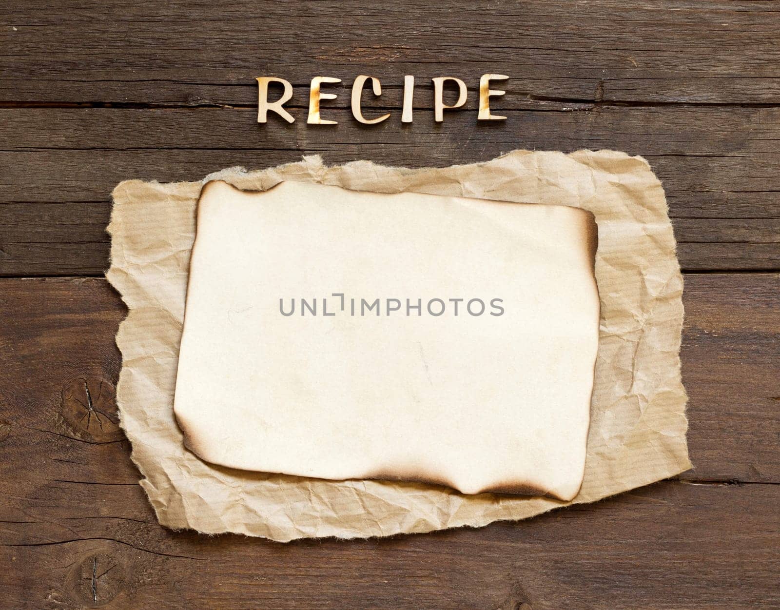 Recipes word with paper on wooden background