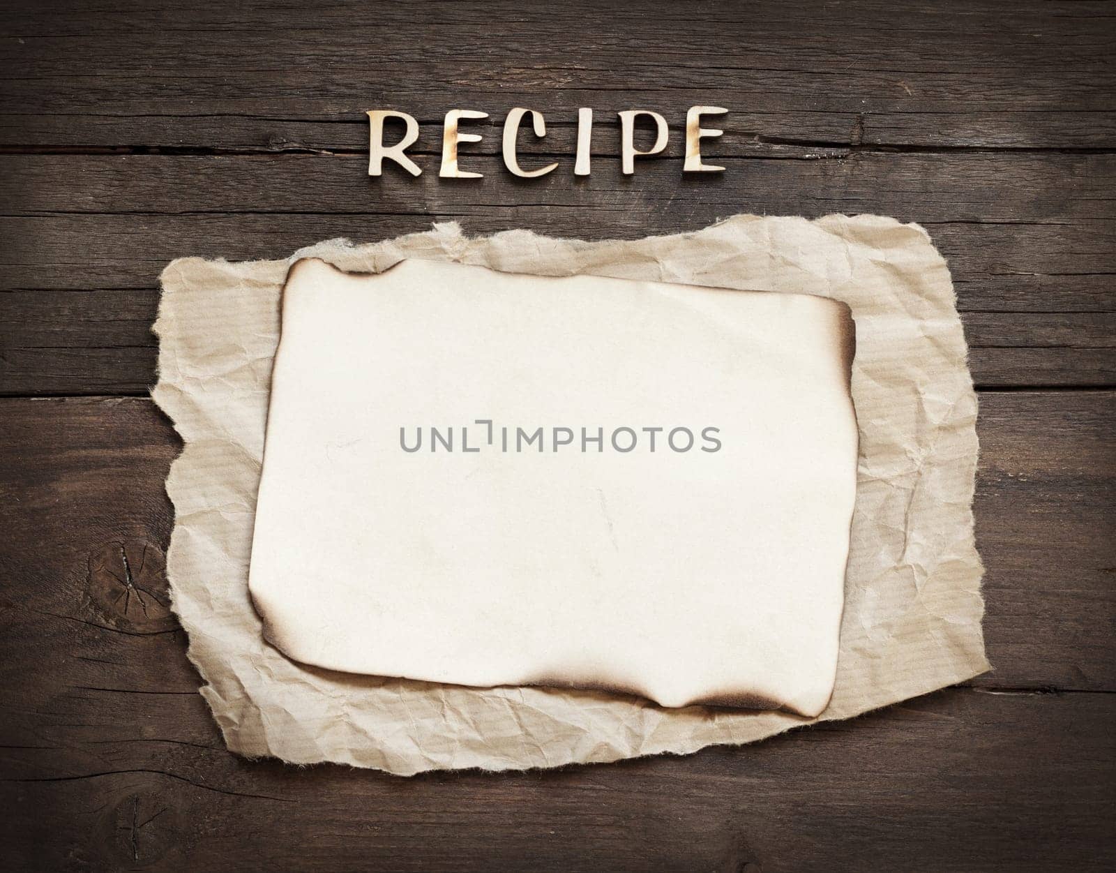 Recipes word with paper on wooden background