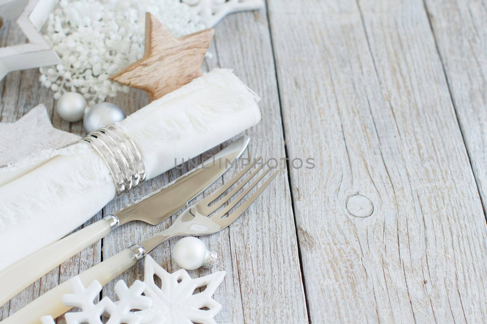 Silver and cream Christmas Table Setting with christmas decorations