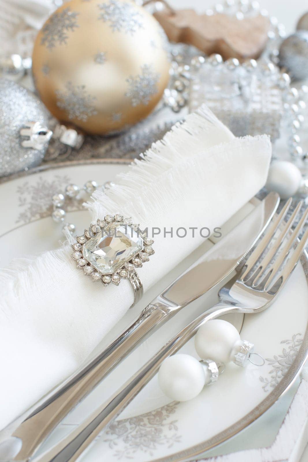 Silver and cream Christmas Table Setting with christmas decorations