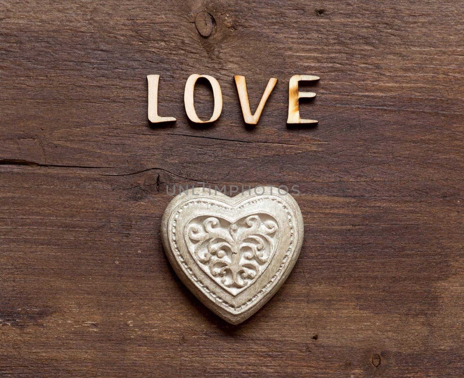 The word of Love and heart on wood