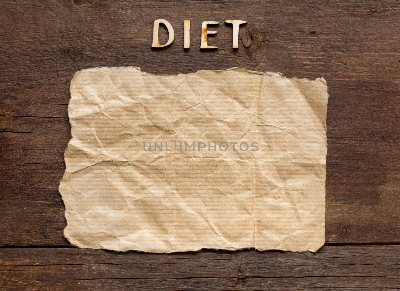 The word of Diet and paper on wooden background