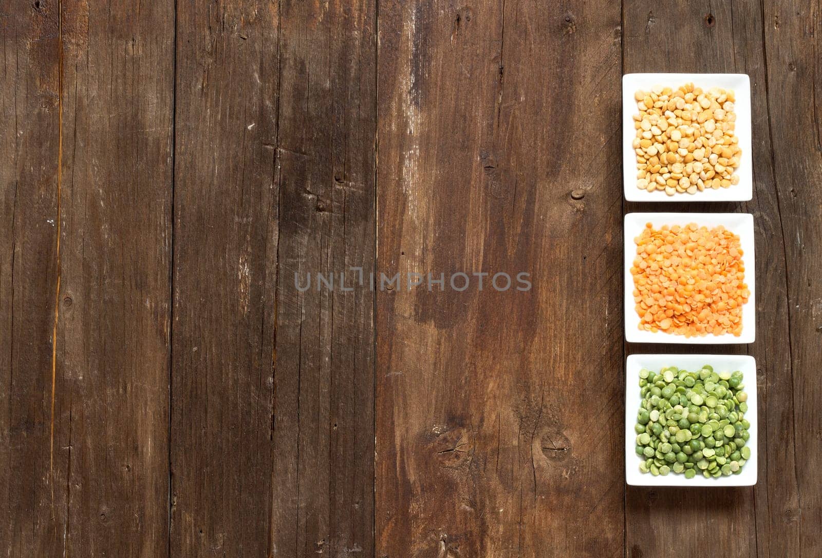 Legumes in bowls on a wooden table