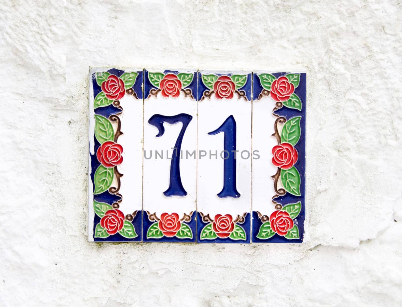 Ceramic Number 71 on the white wall