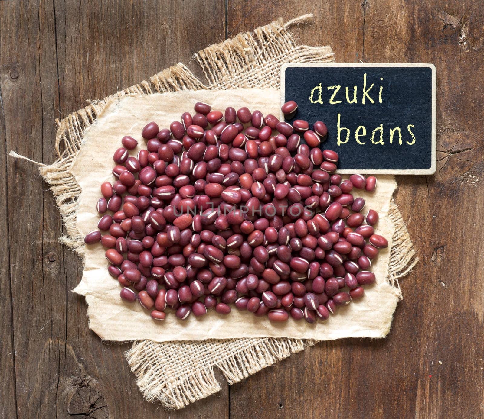 Azuki beans with small chalkboard on a wooden table