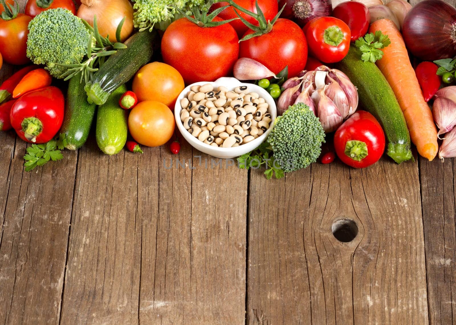 Black eyed peas in a bowl and vegetables